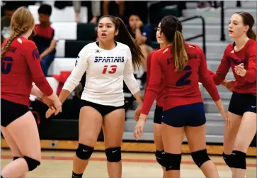  ?? RECORDER FILE PHOTO BY NAYIRAH DOSU ?? Strathmore High School volleyball celebrates scoring a point during a game at Lindsay High School, Sept. 30, 2019. The CIF announced Tuesday, Dec. 1, fall sports are on hold until new guidance is received in January 2021 and fall state playoffs are canceled.