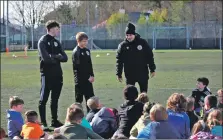  ?? ?? Coaches get their point across to the children at the recent Gaelic football camp held in Portree.