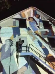  ?? PHOTO BY DILLON PAUL ?? In progress - Original drawing projected onto building with Lindsey Wolkowicz.