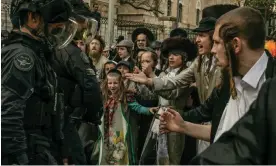  ?? ?? Haredi families confront members of the Israel Defense Forces in Mea Shearim, the ultraOrtho­dox neighbourh­ood in Jerusalem. Photograph: Alessio Mamo/The Guardian