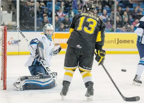  ?? LIAM RICHARDS/THE STAR PHOENIX ?? Saskatoon Blades goaltender Nik Amundrud makes a save against the Brandon Wheat Kings during the first period of WHL action on Saturday.