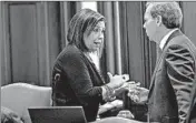  ?? ZBIGNIEW BZDAK/CHICAGO TRIBUNE ?? Sen. Iris Martinez talks with Senate President John Cullerton in 2015 at the Illinois Capitol in Springfiel­d.