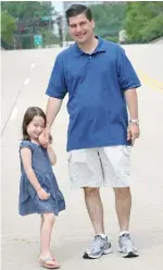  ?? | SUN- TIMES FILES ?? Chicago Police Cmdr. Paul Bauer with his daughter.