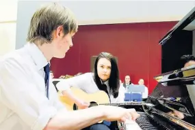  ??  ?? Perfect harmony duet Emily Shields and Neil Sutcliffe performed a piano and guitar