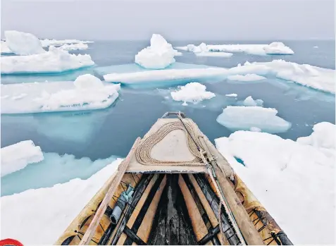  ??  ?? Frozen in time: a umiak skin boat used in traditiona­l whaling shown in a print by Kiliii Yuyan; left, a woman’s hat, pre-1919