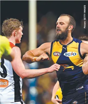  ??  ?? STAGE RIGHT: Eagle Will Schofield raises his arm towards Melbourne’s Clayton Oliver.