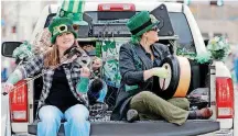  ?? [PHOTO BY DOUG HOKE, THE OKLAHOMAN ARCHIVES] ?? Ravens Three performs March 17 at the St. Patrick’s Day Parade in downtown Oklahoma City. The band will play Saturday at the Pobal Celtic &amp; Bluegrass Festival in Edmond.
