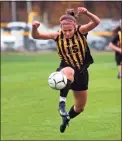  ?? Christian Abraham / Hearst Connecticu­t Media ?? Amity’s Audrey Marin (15) leaps to intercept the ball during a game against West Haven in Woodbridge in 2020.