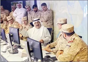  ?? KUNA photo ?? Acting Prime Minister and Defense Minister Sheikh Nasser Sabah Al-Ahmad Al-Sabah carried out an inspection tour of the Kuwait Air Force and Air Defense Forces operations command center on Sunday to check the readiness of the armed forces due to the heightened tensions in the region. Above: Sheikh Nasser
at the command center.