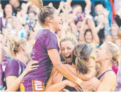  ??  ?? BRING IT ON: Laura Geitz of the Firebirds and team mates celebrate victory after the 2015 ANZ Championsh­ip grand final.