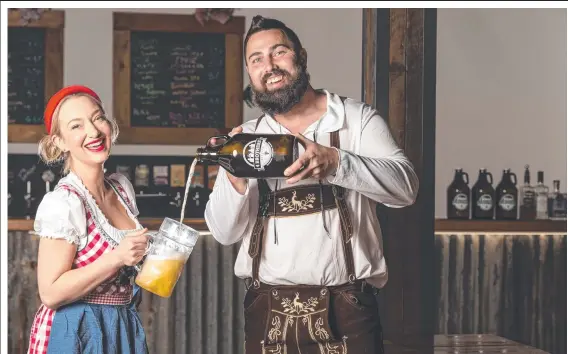  ?? Picture: Kevin Farmer ?? PROST: Josie Adams and Adrian Cubit from 4 Brothers Brewing have teamed up with Konig's Biergarten Toowoomba to celebrate Oktoberfes­t.