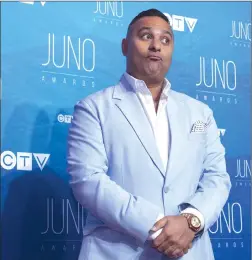  ?? Canadian Press photo ?? Host Russell Peters poses on the red carpet ahead of the Juno awards show in this file photo.