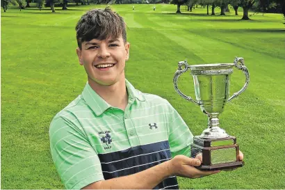  ?? PAT CASHMAN ?? Portumna’s Sam Murphy celebrates with the trophy after winning the Irish U-18 Boys at Thurles yesterday