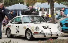  ??  ?? Below far left: The weather might have been less than stellar; still, participan­ts showed up en masse on Sunday
Left: John Benton’s ‘MEIN12’ was part of the strong 912 contingent at the Phoenix Club event
Below left: Here is a Porsche you don’t often see: a ’67 912 ‘soft window’ Targa, number 74 of 544 assembled
Below right: Impact bumper 2.7L-powered Carrera looked great wearing gold Fuchs rims