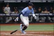  ?? SCOTT AUDETTE — THE ASSOCIATED PRESS ?? Tampa Bay Rays’ Yu Chang watches his two-run single against the New York Yankees during the eighth inning Friday in St. Petersburg, Fla.