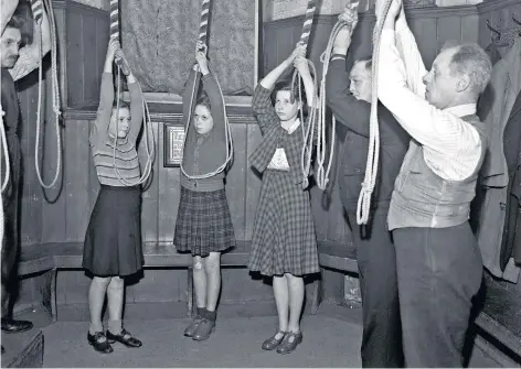  ??  ?? Ringing a bell: volunteers gather in Netherton Parish Church in the West Midlands, 1948