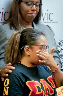  ?? AP ?? Public Advocate Leticia James comforts Flor Reyes, 20, a student at Lehman College who came from Mexico to the US when she was two-year-old, as she make emotional remarks during a Press conference in New York.—