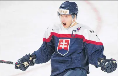  ?? CP PHOTO ?? Slovakia’s Martin Reway celebrates after scoring against Germany during first period preliminar­y round hockey action at the IIHF World Junior Championsh­ip in Montreal in December 2014.
