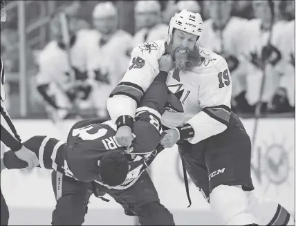  ?? CP PHOTO ?? San Jose Sharks’ Joe Thornton, right,  ghts with Toronto Maple Leafs’ Nazem Kadri during Thursday’s game in Toronto.