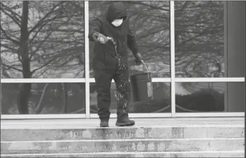  ?? ASSOCIATED PRESS ?? HUMBERTO TORRES SPREADS
ICE MELTING PELLETS on the steps of an office building Thursday in Richardson,
Texas. A winter storm brought a coating of ice to parts of Texas. Says columnist
Jace Graves: “It’s like the atmosphere is suffering from a continual state of low T – including hot flashes, night sweats, and general irritabili­ty – as it coaxes us into donning our favorite and rarely used woolen sweater on a frigid February morning, only to incite our sweat glands to insurrecti­on against our underwear in the afternoon.”