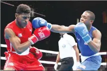  ??  ?? In this Aug 2, 2019 file photo, Keyshawn Davis, (right), of the United States, hits Andy Cruz, of Cuba, during their men’s light welterweig­ht final boxing
bout at the Pan American Games in Lima, Peru. (AP)