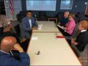  ?? CAROL HARPER — THE MORNING JOURNAL ?? Lorain City Schools Chief Executive Officer David Hardy Jr., facing the camera, chats with faith leaders including, from front left, the Rev. Tim Williams from Greater Victory Christian Ministries, the Rev. Marilyn Parker Jeffries from New Creation...