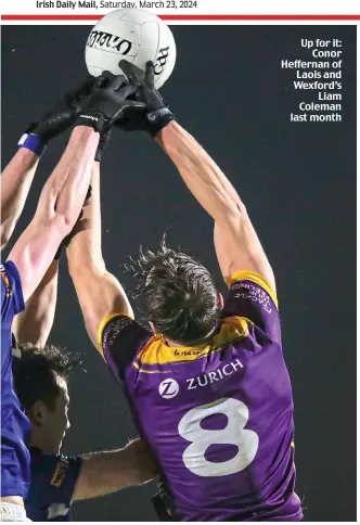  ?? ?? Up for it: Conor Heffernan of Laois and Wexford’s Liam Coleman last month