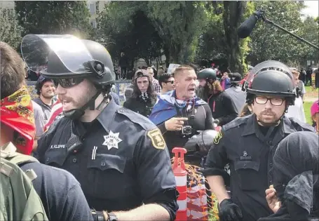  ?? David Butow For The Times ?? BERKELEY POLICE can now use pepper spray on protesters they deem violent after the City Council lifted a 20-year-old ban this week.