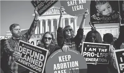  ??  ?? Both sides gather in January to mark the anniversar­y of the 1973 Supreme Court ruling that legalized abortion. ALEX WONG/GETTY IMAGES