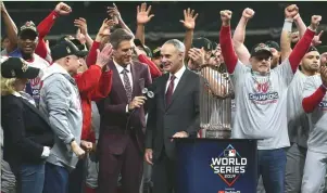  ?? (Reuters) ?? MLB COMMISSION­ER Rob Manfred (center) and the players are playing a dangerous game. The longer the two sides can’t reach an agreement to play, the harder it may be for fans to forgive.