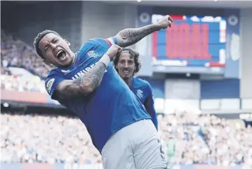  ?? PICTURE: IAN MACNICOL/GETTY ?? James Tavernier celebrates after scoring Rangers’ opening goal in the 3-1 win over Hibs at Ibrox