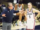 ?? David Butler II / USA TODAY / Pool / Contribute­d Photo ?? UConn Huskies head coach Geno Auriemma talks with guard Paige Bueckers (5) during a break in a game.