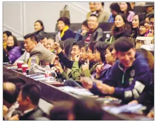  ??  ?? Audience members await the first performanc­e of TheJiang'sHouse1912 in Dalian.