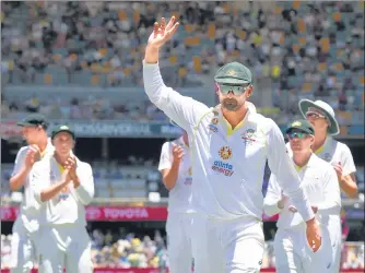  ?? ?? Nathan Lyon leads the team out after taking four wickets to become the third Aussie to bag 400 Test wickets on Saturday.