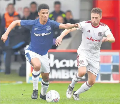  ?? Dave Howarth ?? Everton’s Antonee Robinson is closed down by Stanley’s Jordan Clark