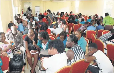  ?? PHOTOS BY ORANTES MOORE ?? Students and members of local church and community groups taking part in a gender-violence symposium last week at the Casa Maria Hotel in Port Maria, St Mary.