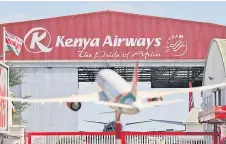  ?? ?? An aircraft model of a Boeing 787-8 Dreamliner bearing Kenya’s national carrier, Kenya Airways (KQ) logo stands outside the headquarte­rs.