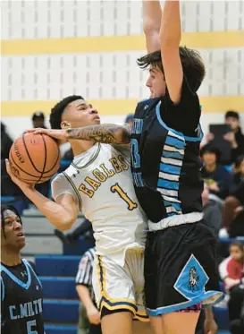  ?? MATT BUTTON/BALTIMORE SUN MEDIA ?? Aberdeen’s Tylan Bass collides with C. Milton Wright’s Dylan Sander as he goes in for the score during Tuesday night’s game.