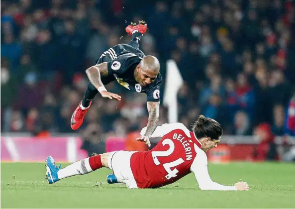  ?? — AFP ?? Airborne: Manchester United’s Ashley Young goes flying after a tackle by Arsenal’s Hector Bellerin at the Emirates on Dec 2. United won 3-1.