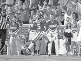  ?? BRYAN TERRY/THE OKLAHOMAN ?? While the Big Red of the North, Nebraska, has struggled the past several years, the Big Red of the South, Oklahoma, has not. OU’s Jaden Knowles runs for a touchdown during Saturday’s 76-0 victory over Western Carolina in Norman.