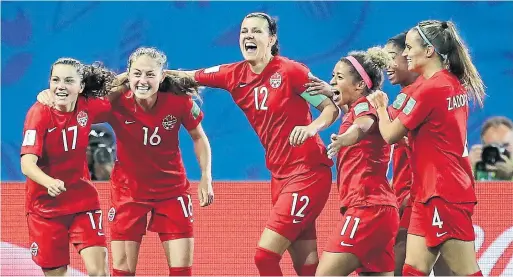  ?? ELSA GETTY IMAGES ?? Christine Sinclair — snakebitte­n on several golden chances — was in the middle of the celebratio­n after Jessie Fleming, left, opened the scoring in Canada’s 2-0 win.