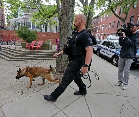  ?? STUART CAHILL / HERALD STAFF ?? ‘SERIOUS SECURITY BREACH’: BPD responds to the discovery of several guns at Charlestow­n High School yesterday in Charlestow­n.