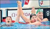  ?? REUTERS ?? USA’S Lydia Jacoby (left) celebrates with compatriot Lilly King (centre) after winning the 100m breaststro­ke gold.