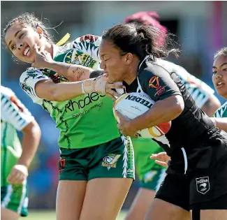  ?? PHOTO: GETTY IMAGES ?? Shontelle Woodman puts a fend on a Cook Islands player during New Zealand’s impressive run to the World Cup final.