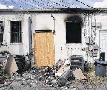  ?? PHOTOS BY MELANIE BELL / THE PALM BEACH POST ?? Maria Bonny, 36, and Roselyne Lindor-Sanon, 31, died after a fire broke out in the back room of the St. Anne & Vierge Miracle Botánica in a strip mall on Belvedere Road, just east of Interstate 95.