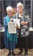  ?? ?? Laurel Billington (left) receives a 45 year Charter award on behalf of her husband Michael Billington, from president Erika Wassenberg.