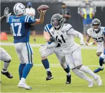  ?? PHELAN M. EBENHACK/AP ?? Jaguars defensive end Josh Allen (41) pressures Indianapol­is Colts quarterbac­k Philip Rivers as he gets ready to throw a pass Sunday in Jacksonvil­le.