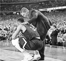  ?? BOB DONNAN, USA TODAY SPORTS ?? Coach Mark Few consoles guard Nigel Williams- Goss during the second half of Gonzaga’s loss in Monday night’s title game.