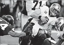  ?? [JIM MONE/THE ASSOCIATED PRESS] ?? Vikings defenders converge to sack Saints quarterbac­k Drew Brees in the first half of Minnesota’s 29-19 victory.