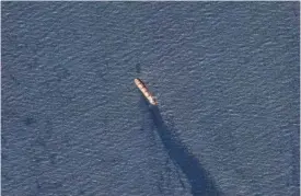  ?? PLANET LABS PBC VIA AP ?? The Belize-flagged bulk carrier Rubymar is seen Tuesday in the southern Red Sea near the Bay el-Mandeb Strait leaking oil after an attack by Yemen's Houthi rebels.